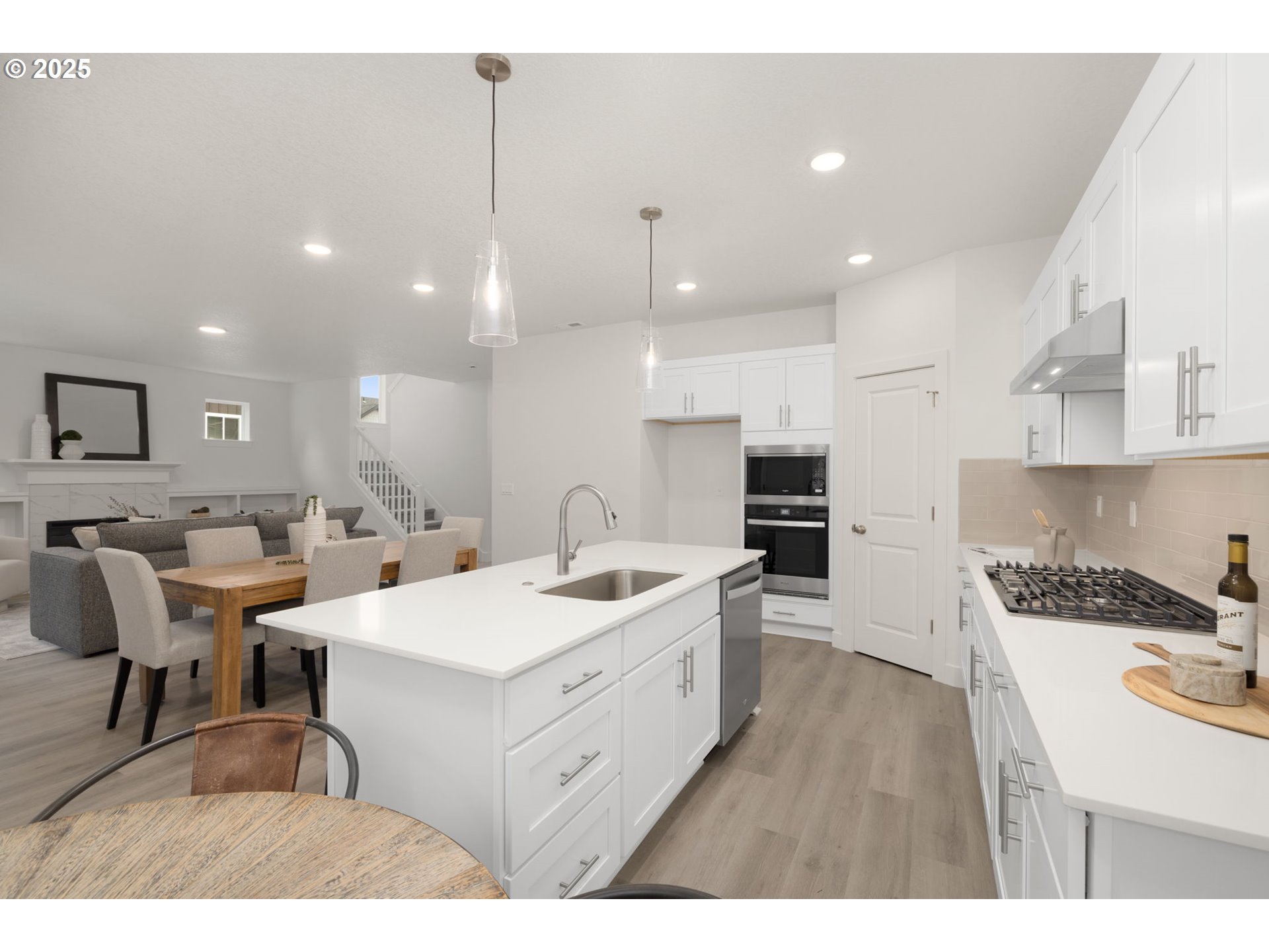 19040 Southwest Northridge Court, Unit LOT 15 Beaverton, OR 97007 - Photo 13 of 34 a large kitchen with a table and chairs