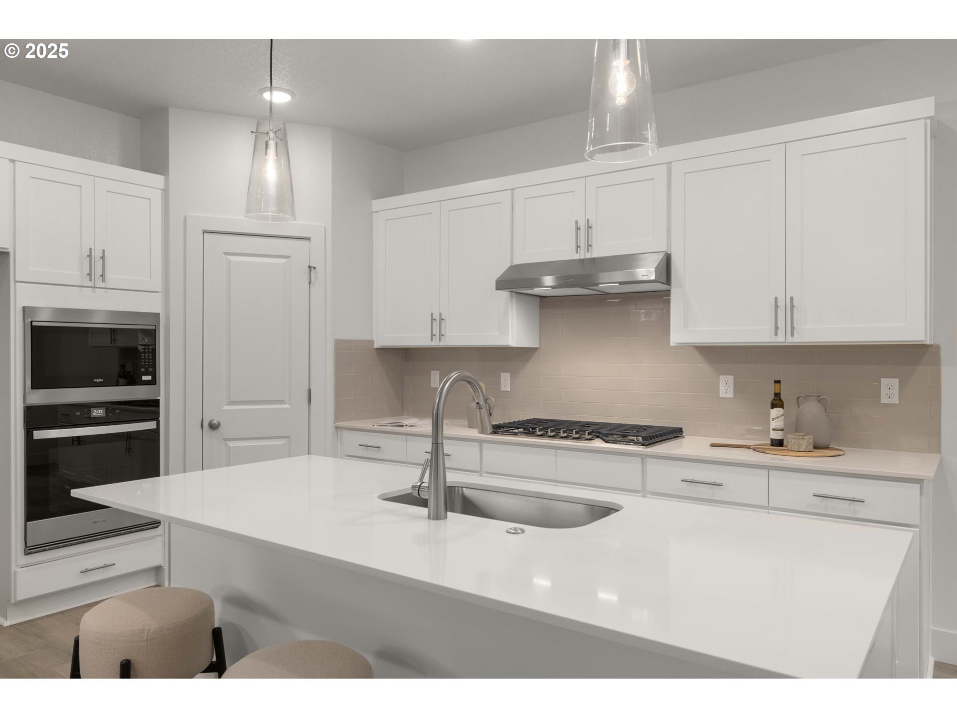 19040 Southwest Northridge Court, Unit LOT 15 Beaverton, OR 97007 - Photo 14 of 34 a kitchen with stainless steel appliances granite countertop a sink stove and refrigerator