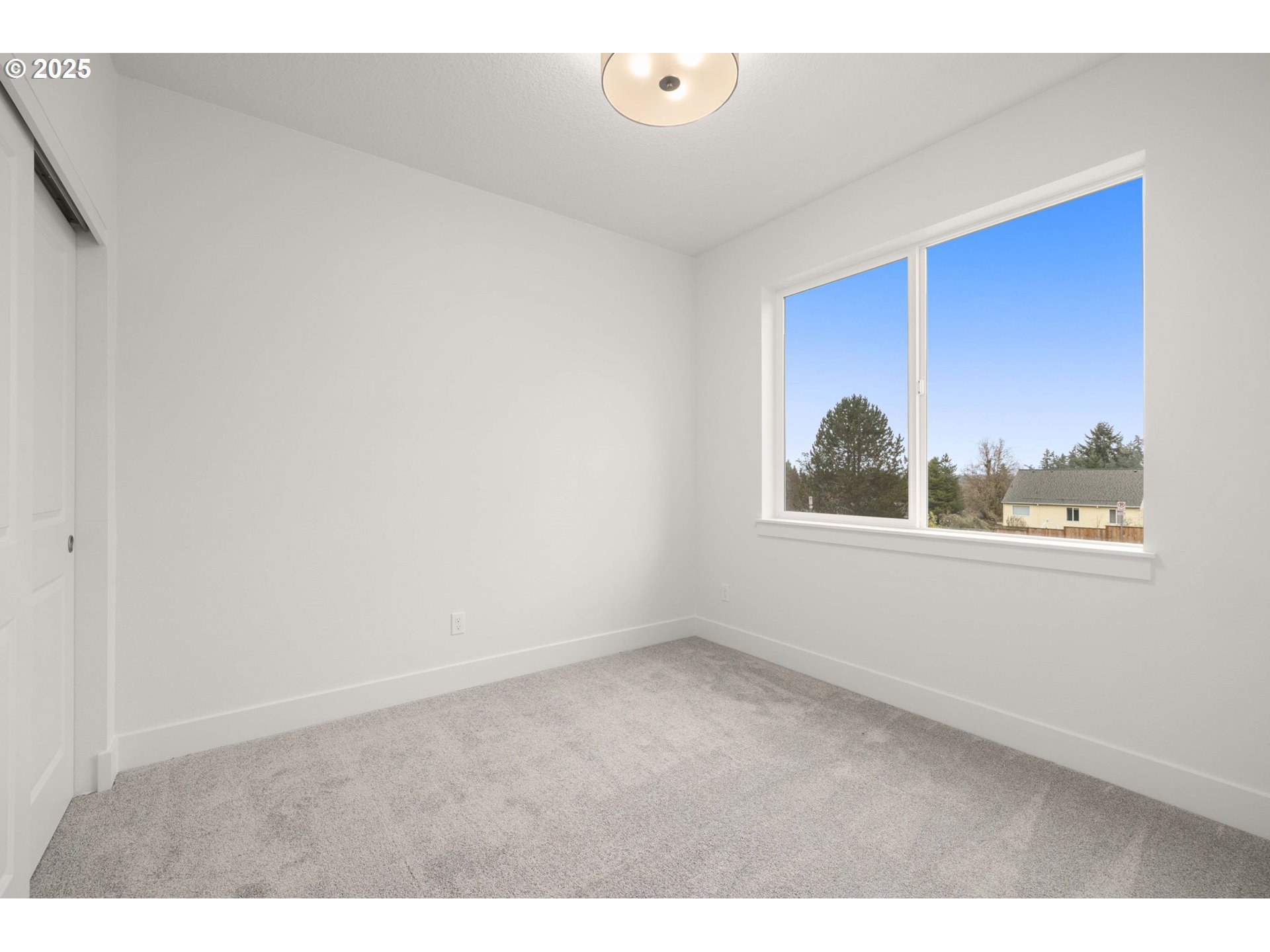 19040 Southwest Northridge Court, Unit LOT 15 Beaverton, OR 97007 - Photo 15 of 34 a view of an empty room with a window