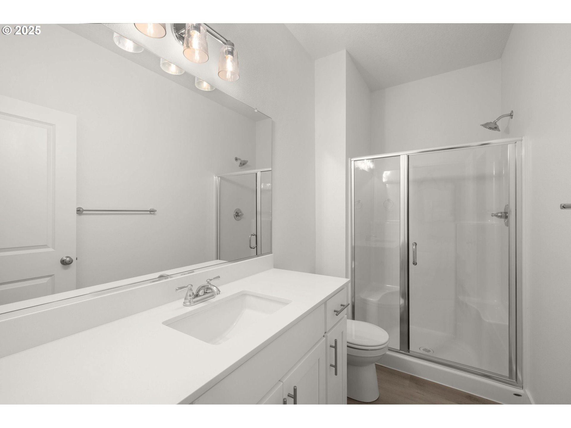 19040 Southwest Northridge Court, Unit LOT 15 Beaverton, OR 97007 - Photo 16 of 34 a bathroom with a sink a toilet and shower