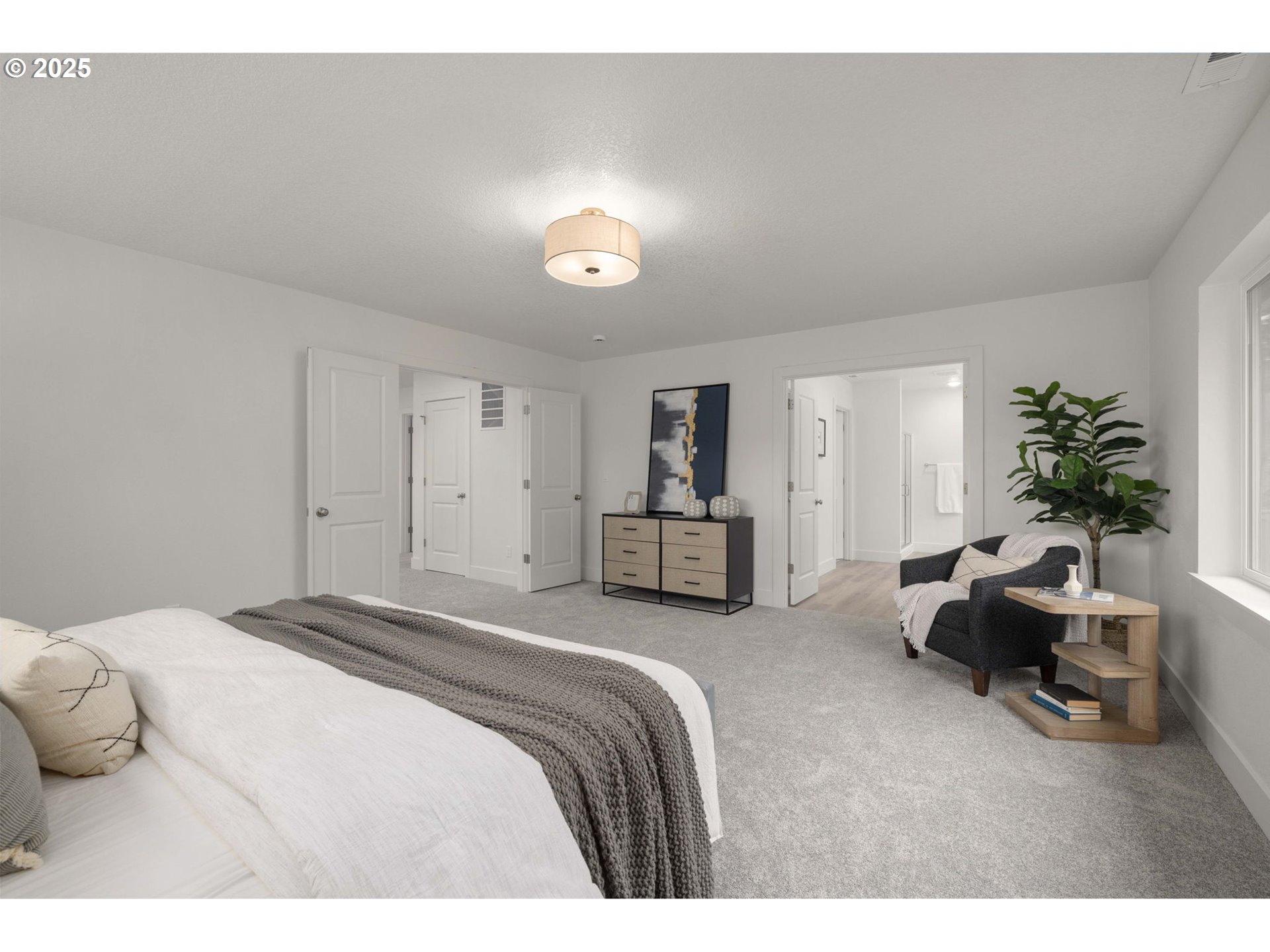 19040 Southwest Northridge Court, Unit LOT 15 Beaverton, OR 97007 - Photo 21 of 34 a spacious bedroom with a bed and a couch