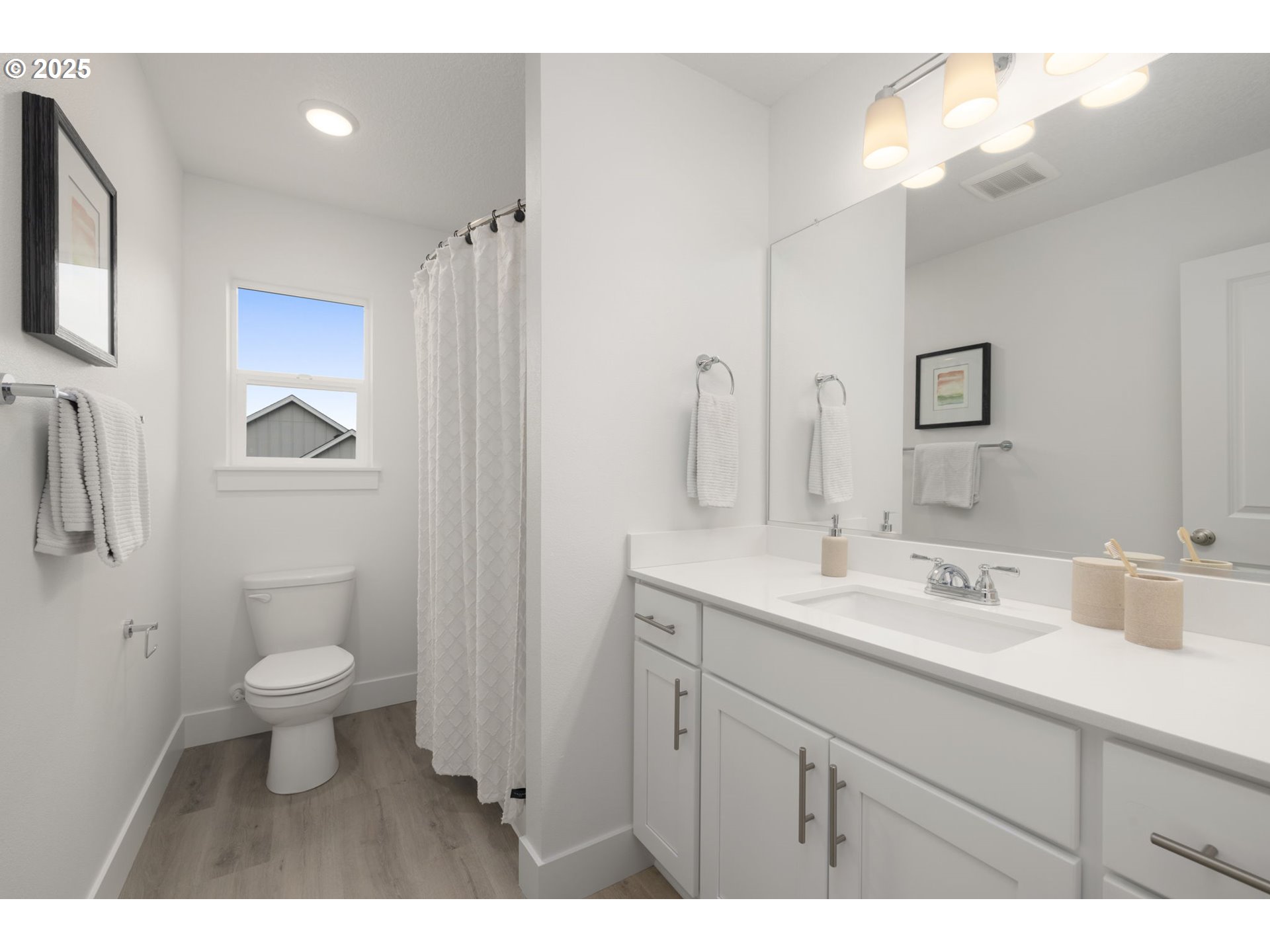 19040 Southwest Northridge Court, Unit LOT 15 Beaverton, OR 97007 - Photo 29 of 34 a bathroom with a sink a toilet and a mirror