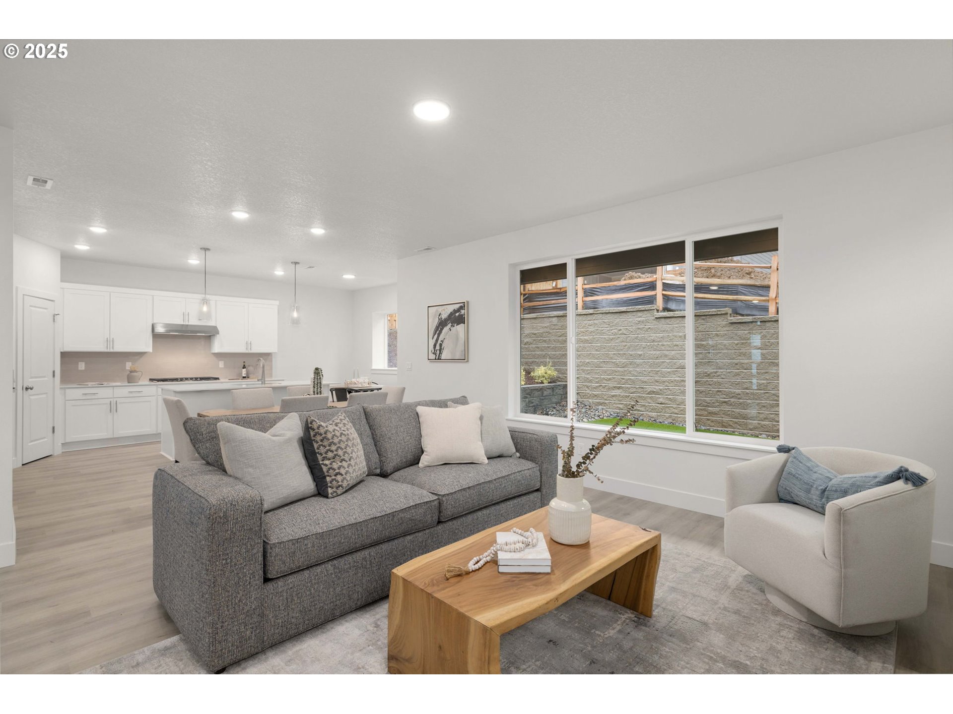 19040 Southwest Northridge Court, Unit LOT 15 Beaverton, OR 97007 - Photo 10 of 34 a living room with furniture and a large window