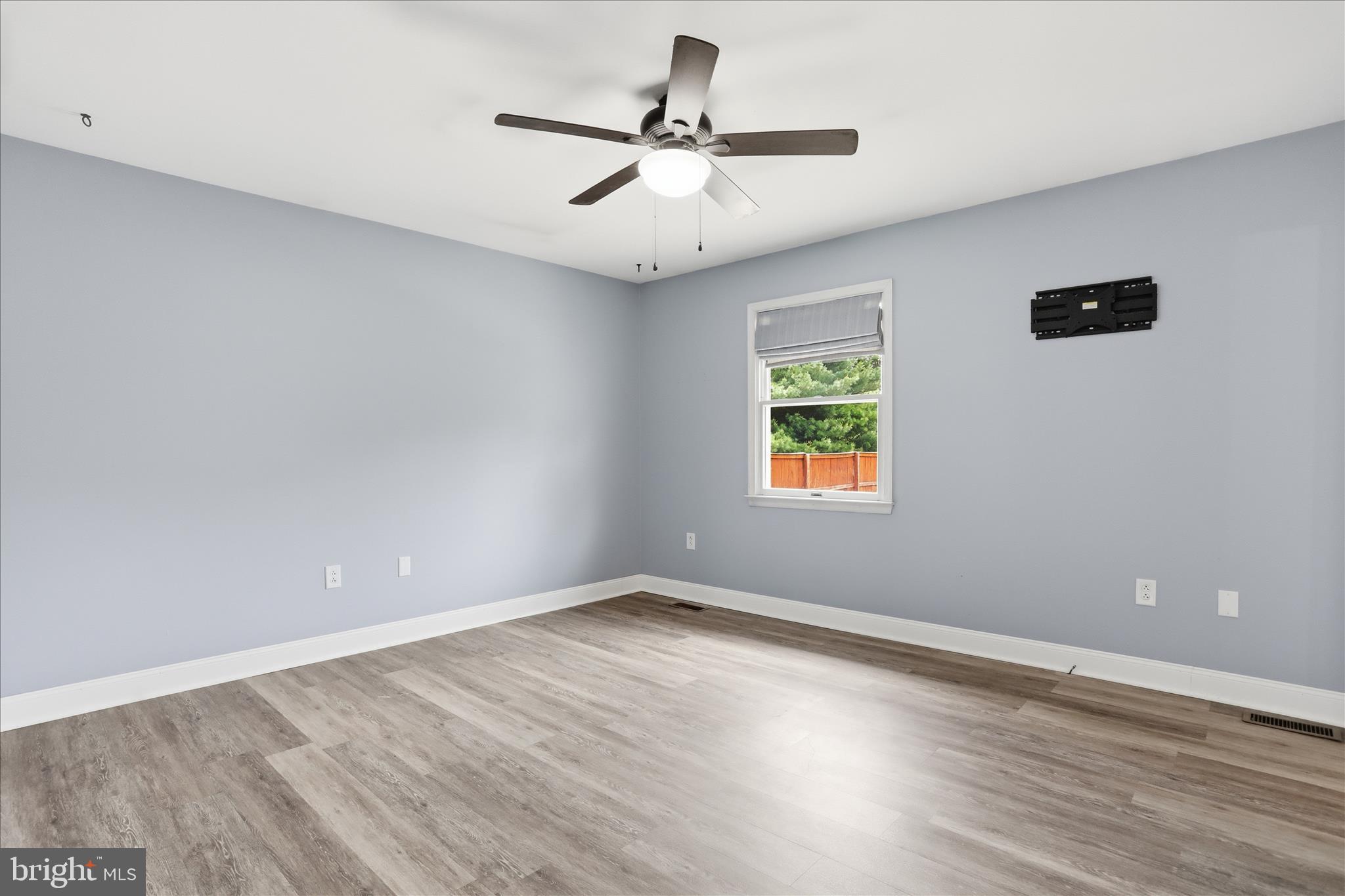 13733 Barnhart Road Clear Spring, MD 21722 - Photo 9 of 32 wooden floor in an empty room with a window