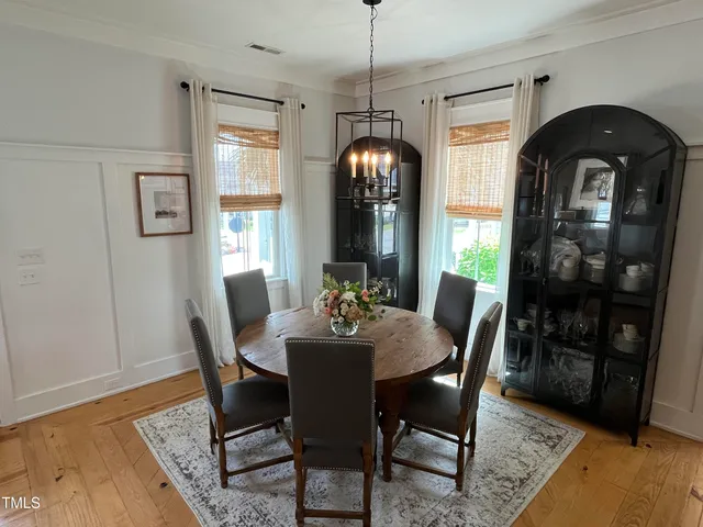 a living room with a couch and a table with wooden floor