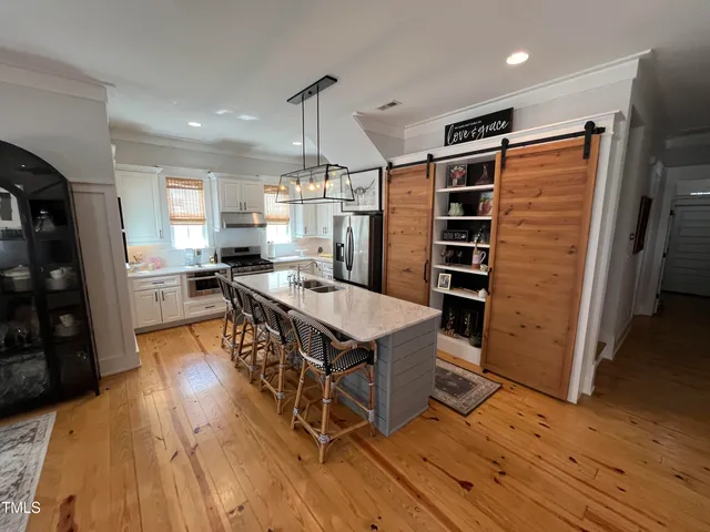 a bathroom with a granite countertop sink mirror vanity and toilet