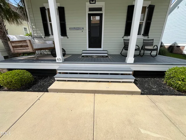a view of balcony with wooden floor
