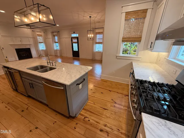 a view of a room with wooden floor