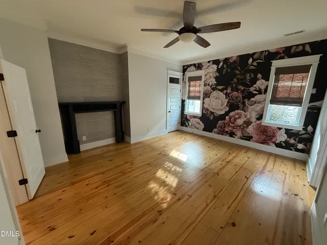 a view of kitchen and wooden floor