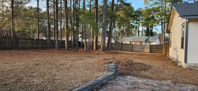 a backyard of a house with lots of green space