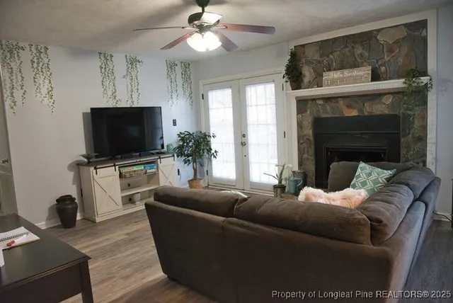 a living room with furniture and a flat screen tv
