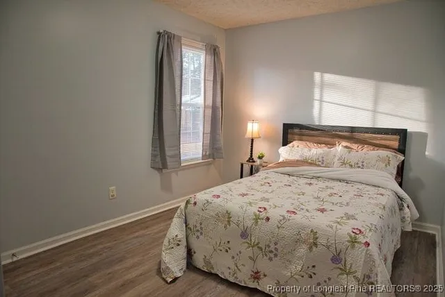 a bedroom with a bed and window