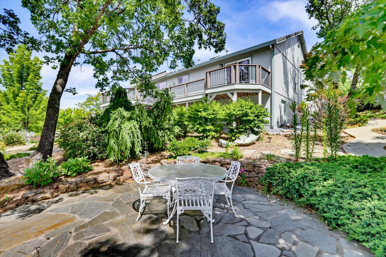 970 Morgan Ranch Drive Grass Valley, CA 95945 - Photo 50 of 76 a view of a patio with table and chairs and potted plants