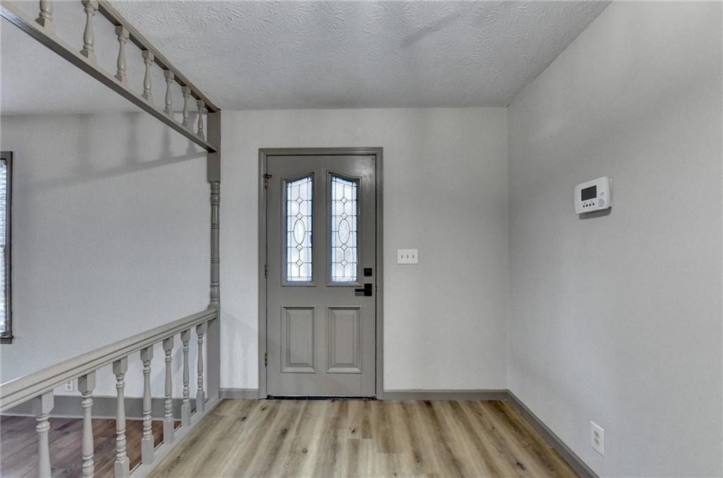2377 Centerville Rosebud Road Loganville, GA 30052 - Photo 13 of 76 a view of entryway with wooden floor
