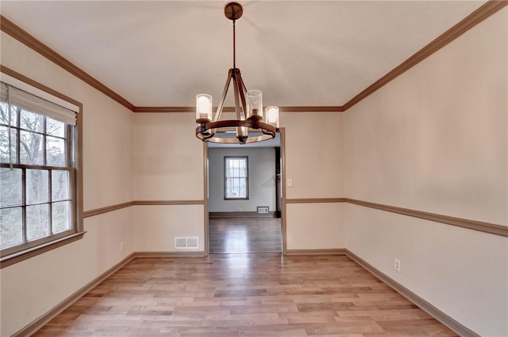 2377 Centerville Rosebud Road Loganville, GA 30052 - Photo 15 of 76 a view of empty room with wooden floor and fan