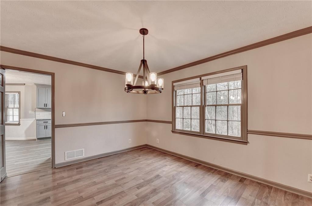 2377 Centerville Rosebud Road Loganville, GA 30052 - Photo 16 of 76 a view of empty room with wooden floor and fan