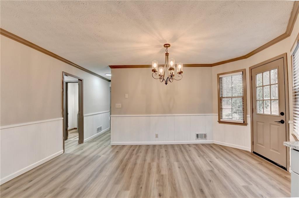 2377 Centerville Rosebud Road Loganville, GA 30052 - Photo 19 of 76 a view of empty room with wooden floor and fan