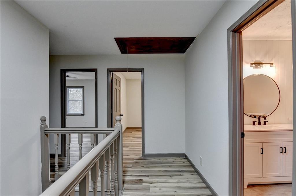 2377 Centerville Rosebud Road Loganville, GA 30052 - Photo 28 of 76 a view of a hallway with wooden floor and entryway
