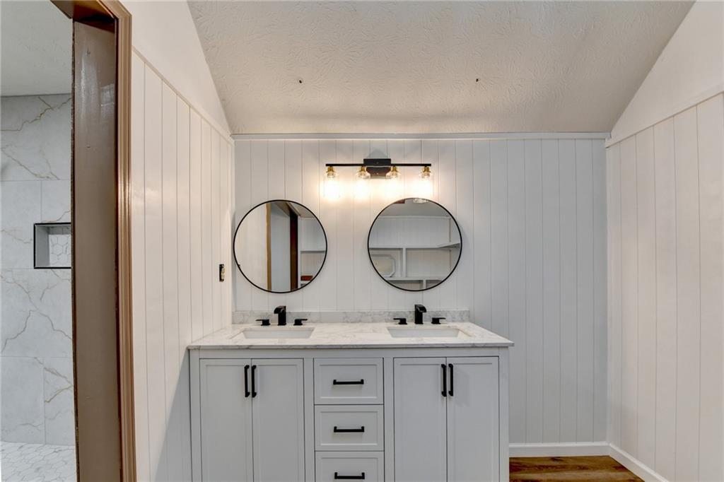 2377 Centerville Rosebud Road Loganville, GA 30052 - Photo 34 of 76 a bathroom with a sink and a mirror