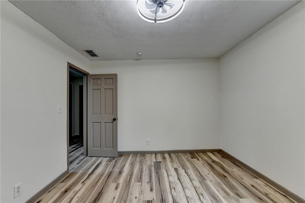 2377 Centerville Rosebud Road Loganville, GA 30052 - Photo 40 of 76 a view of room with window and wooden floor