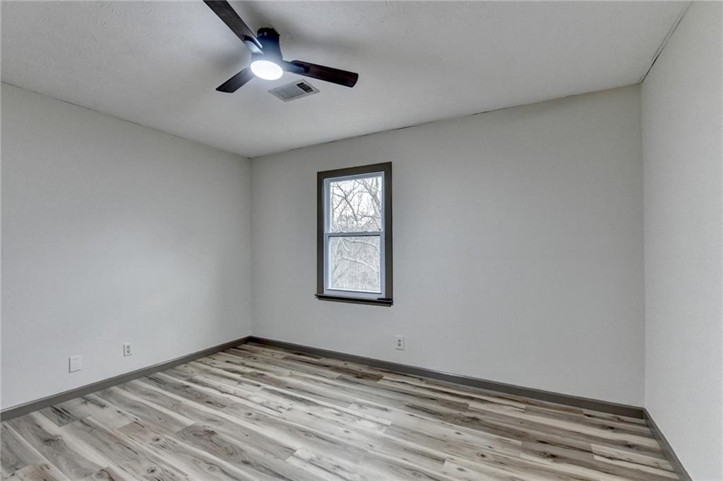 2377 Centerville Rosebud Road Loganville, GA 30052 - Photo 41 of 76 a view of empty room with window and ceiling fan