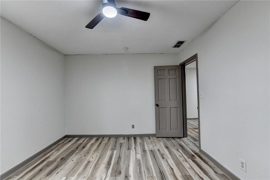 2377 Centerville Rosebud Road Loganville, GA 30052 - Photo 43 of 76 a view of an empty room with wooden floor