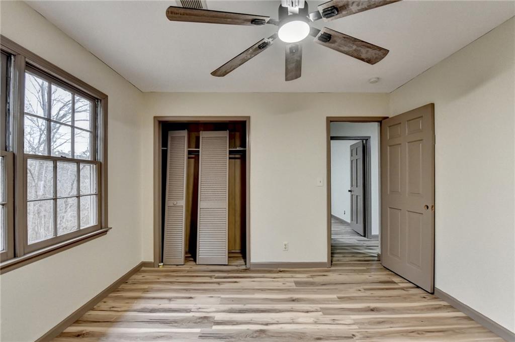 2377 Centerville Rosebud Road Loganville, GA 30052 - Photo 46 of 76 a view of a livingroom with a ceiling fan and a window
