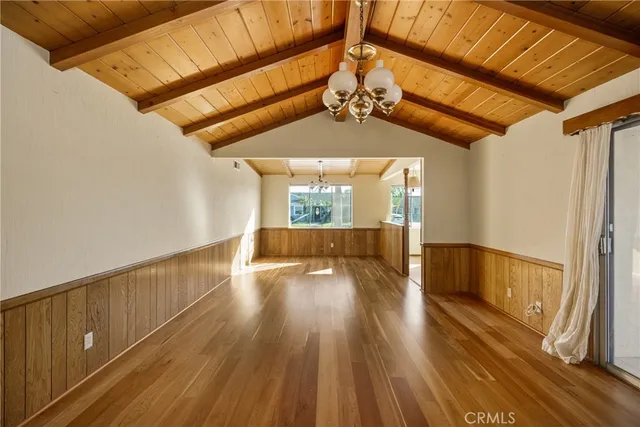 a view of gallery with wooden floor