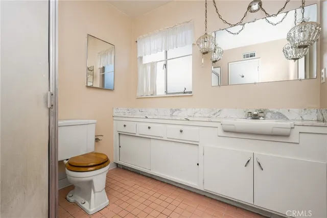 a bathroom with a glass shower door and a shower