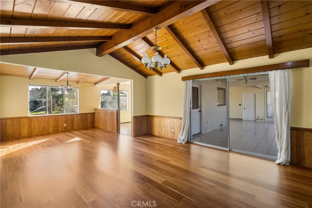 a view of an empty room with glass door