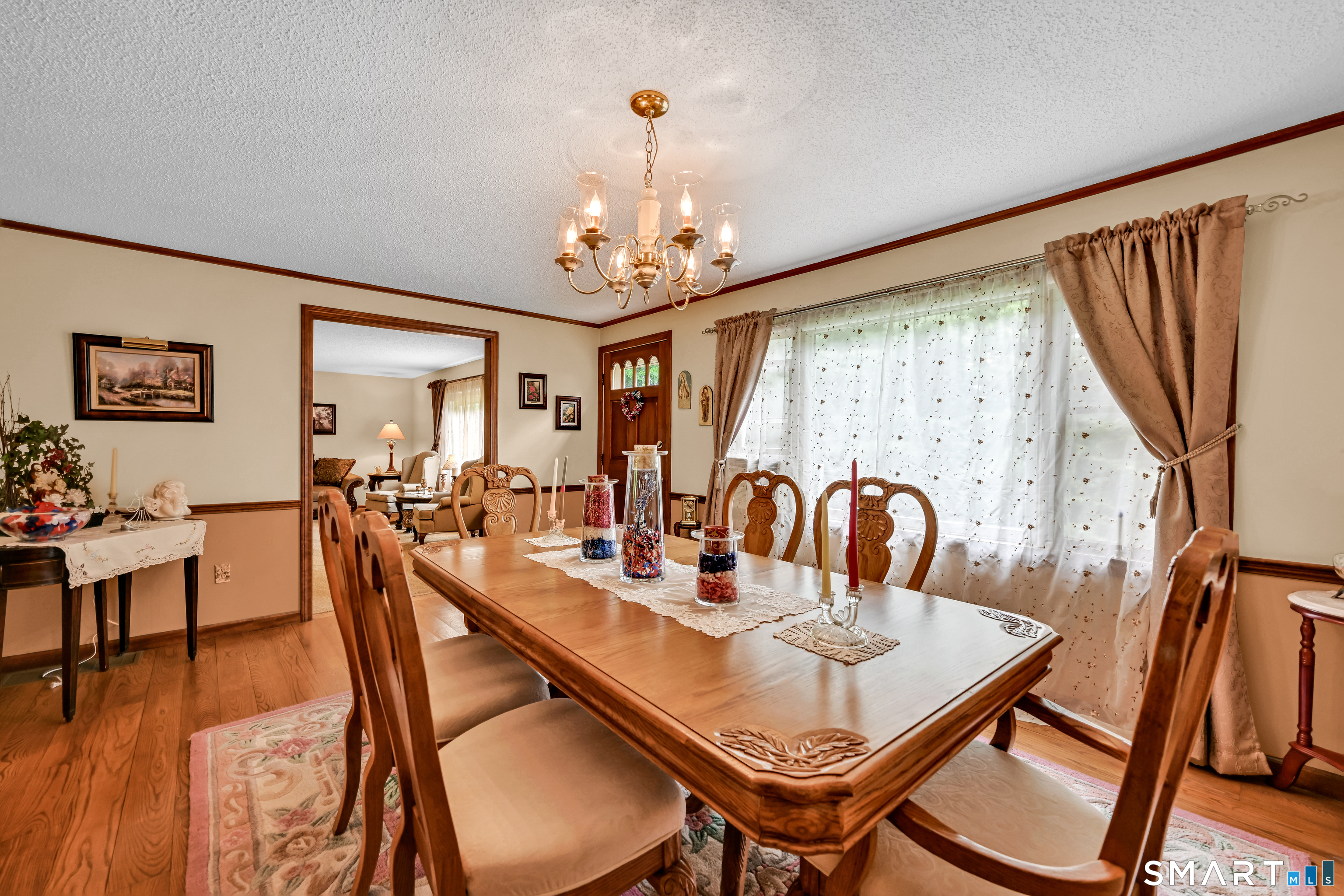 155 Lake Harwinton Road Harwinton, CT 06791 - Photo 10 of 39 a view of a dining room with furniture window and wooden floor