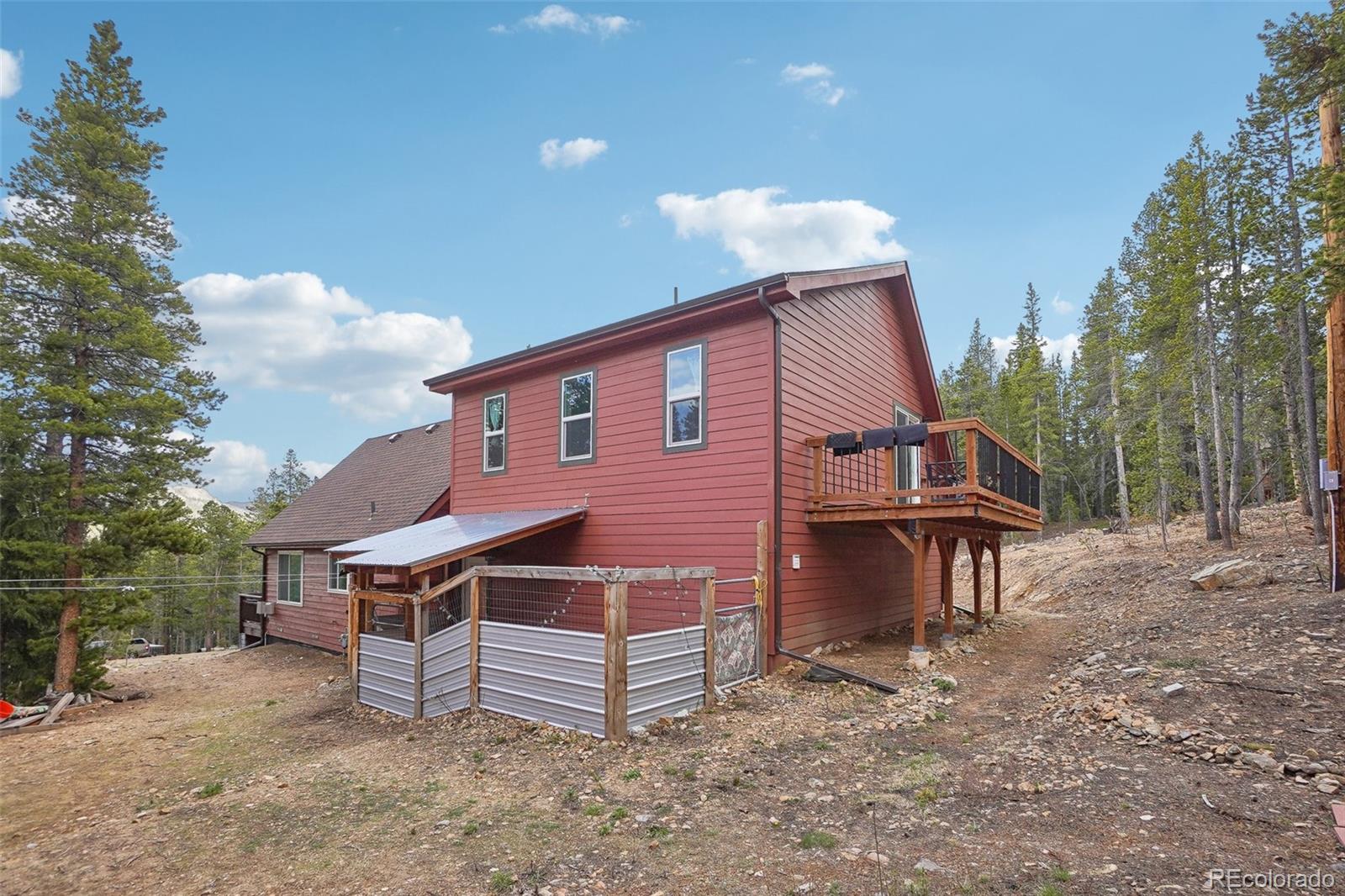 125 Aspen Road Black Hawk, CO 80422 - Photo 41 of 44 a view of a house with a yard and wooden fence