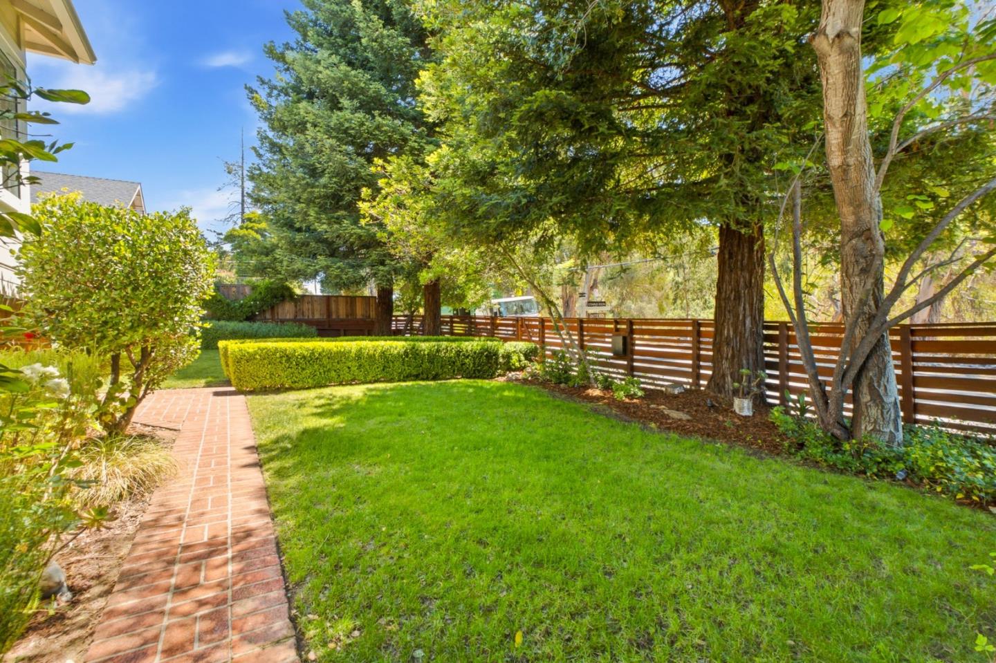 9858 Golf Links Road Oakland, CA 94605 - Photo 37 of 39 a view of a backyard with large trees