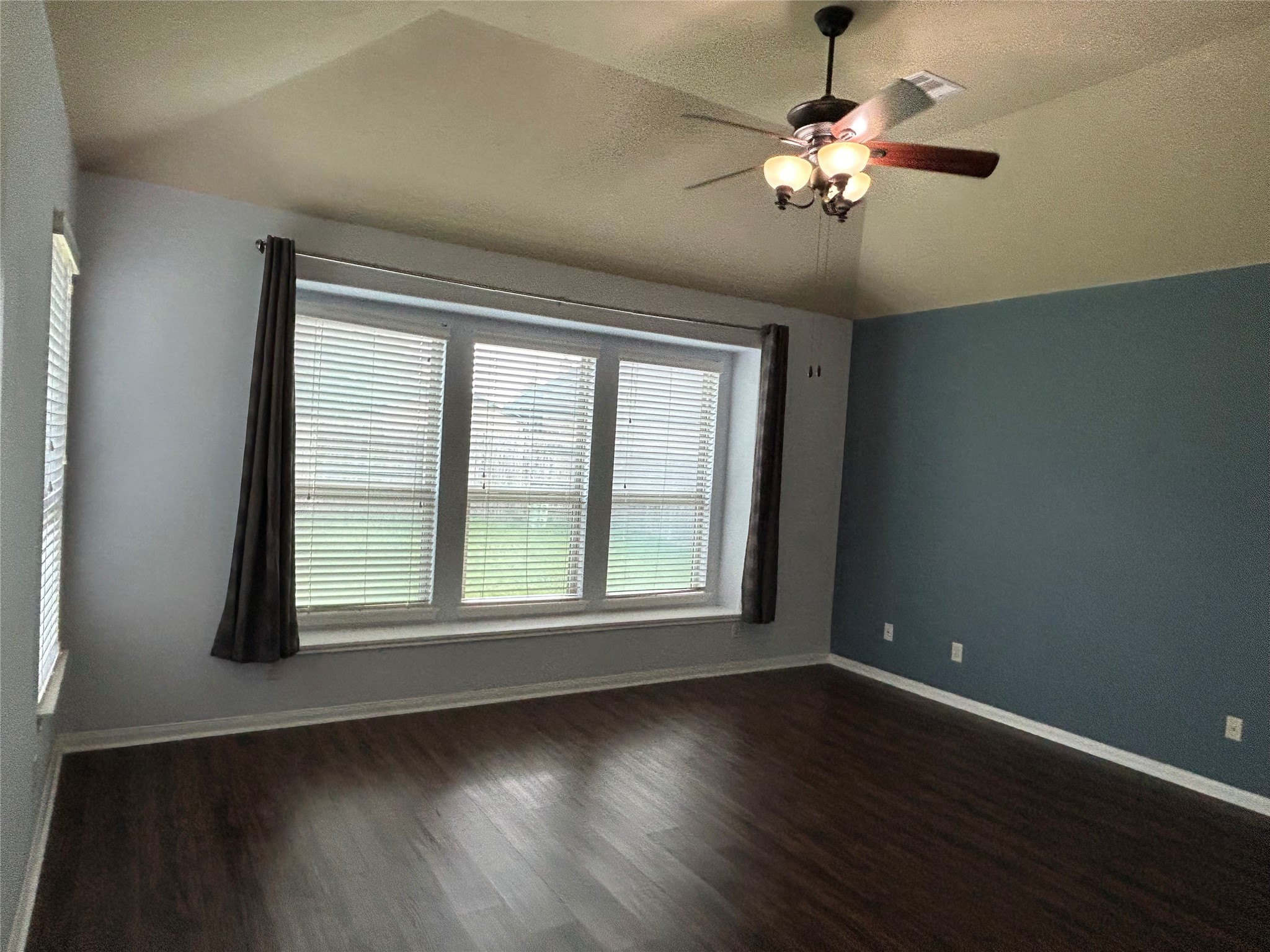 7936 Lake Commons Drive Rosenberg, TX 77469 - Photo 20 of 33 a view of an empty room with wooden floor and a window
