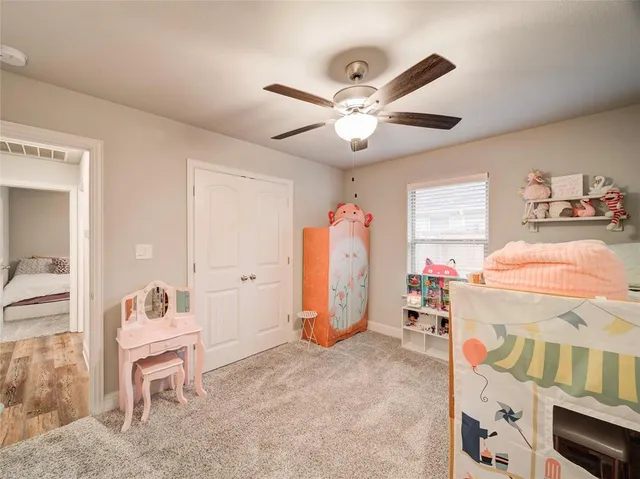 a bedroom with furniture and a window