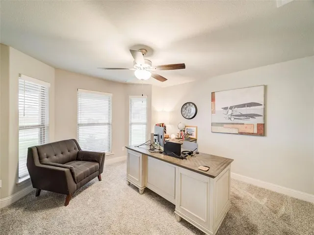 a living room with furniture and window