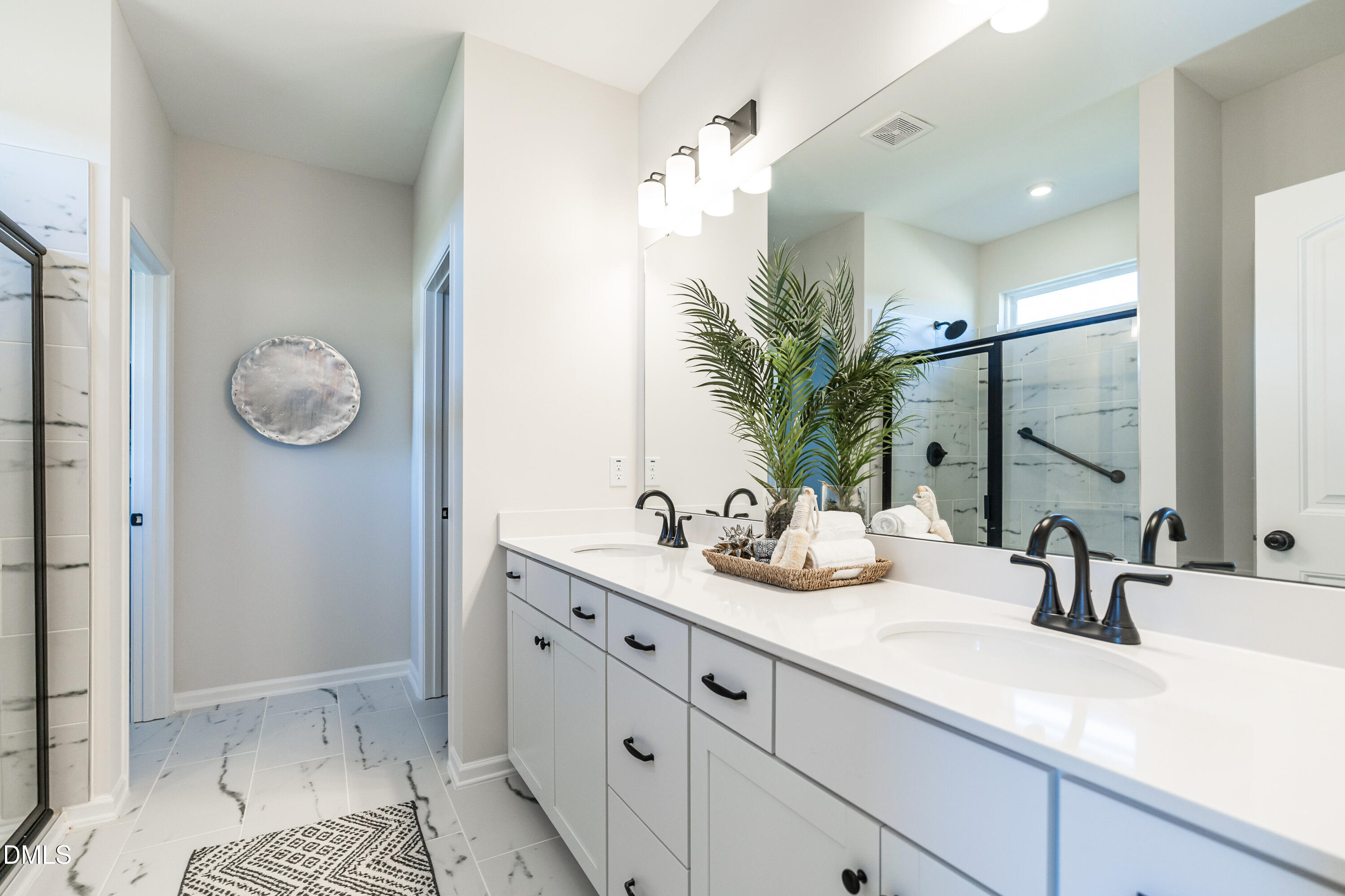 308 Spirit Spgs Road Smithfield, NC 27577 - Photo 13 of 21 a bathroom with a double vanity sink mirror and shower