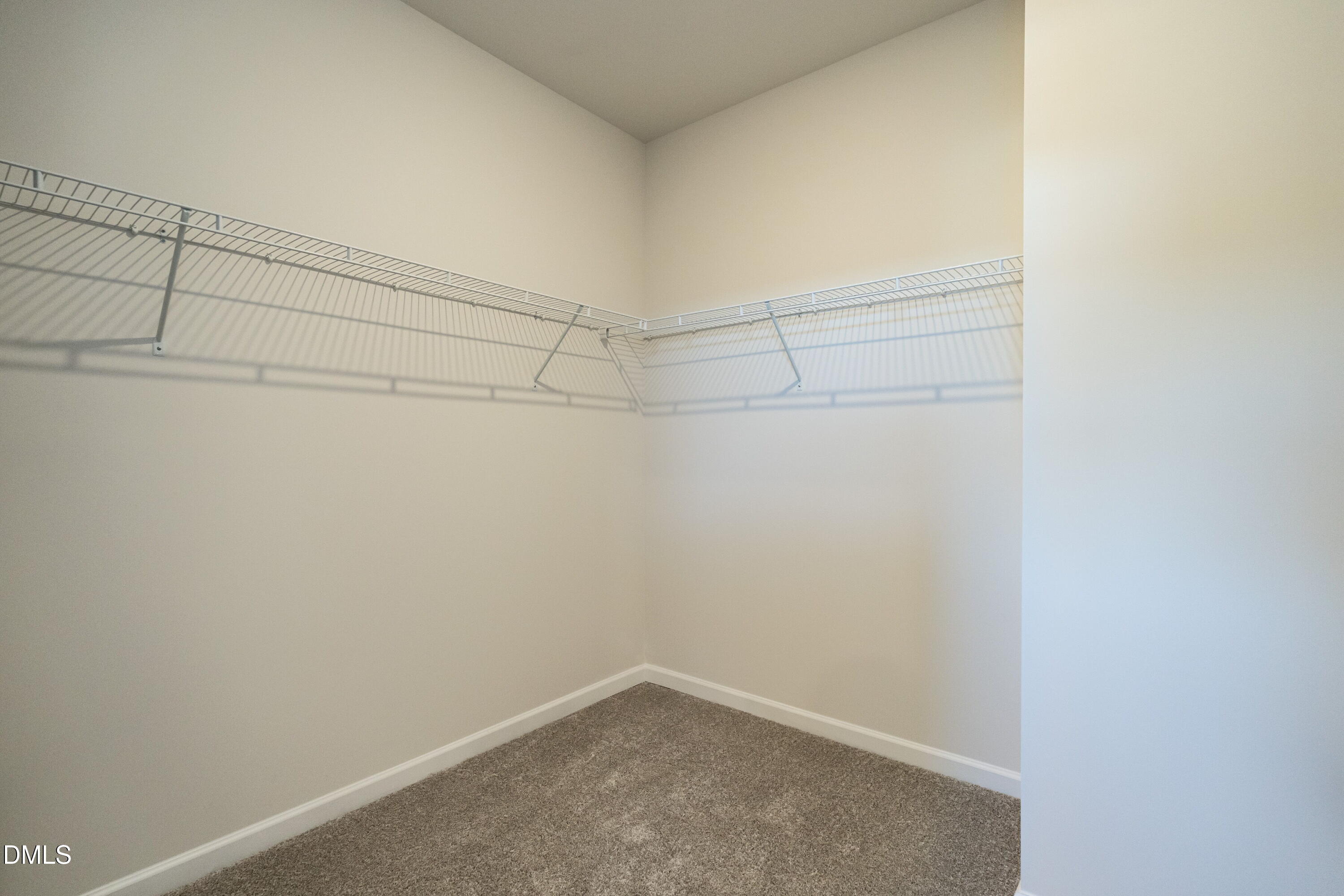 308 Spirit Spgs Road Smithfield, NC 27577 - Photo 16 of 21 a view of a room with racks on the wall