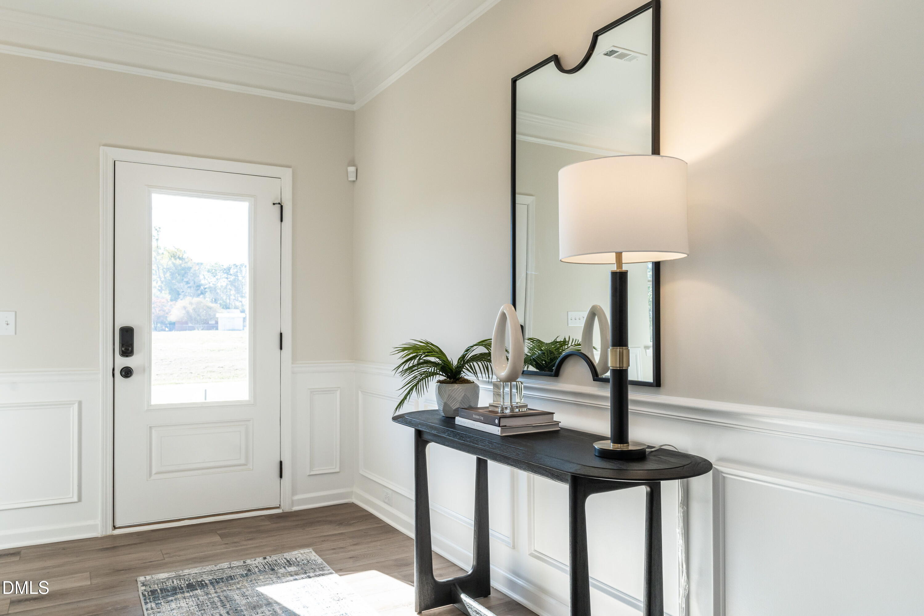 308 Spirit Spgs Road Smithfield, NC 27577 - Photo 2 of 21 a view of a room with a mirror and wooden floor