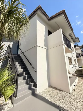 a view of a house with a door and wooden floor
