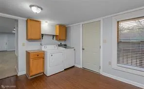 a bathroom with a sink a mirror and a shower