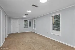 a view of an empty room with a window