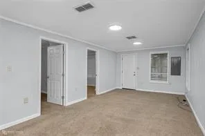 a view of an empty room with a window