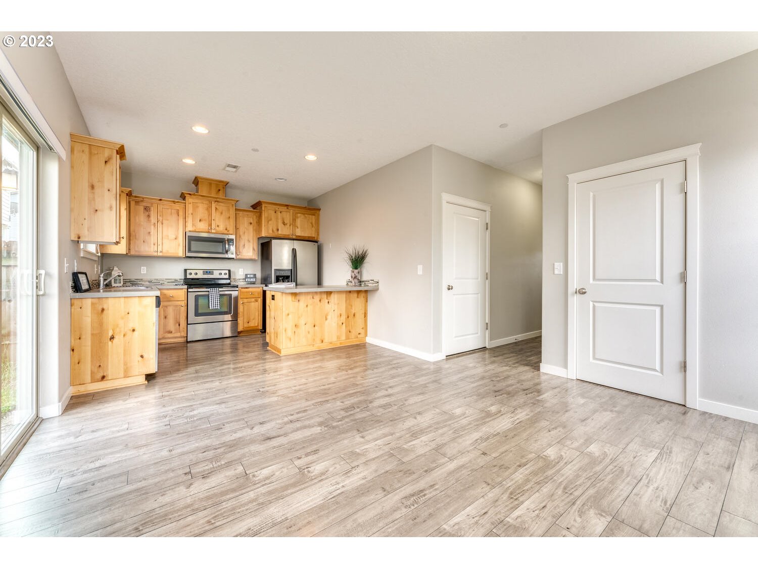260 North 43rd Place Ridgefield, WA 98642 - Photo 3 of 20 a view of kitchen with wooden floor