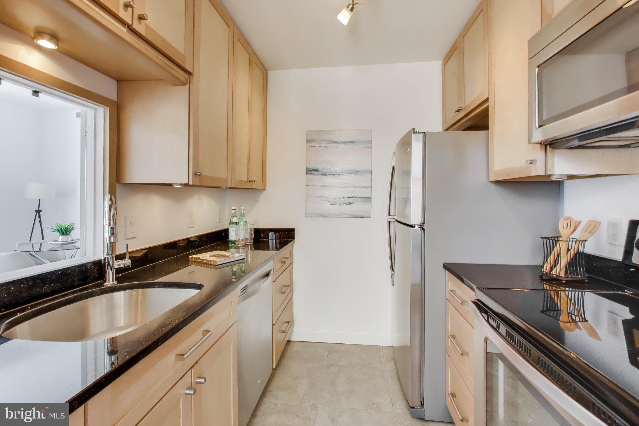 1830 17th Street Northwest, Unit 501 Washington, DC 20009 - Photo 7 of 22 Tall maple cabinets