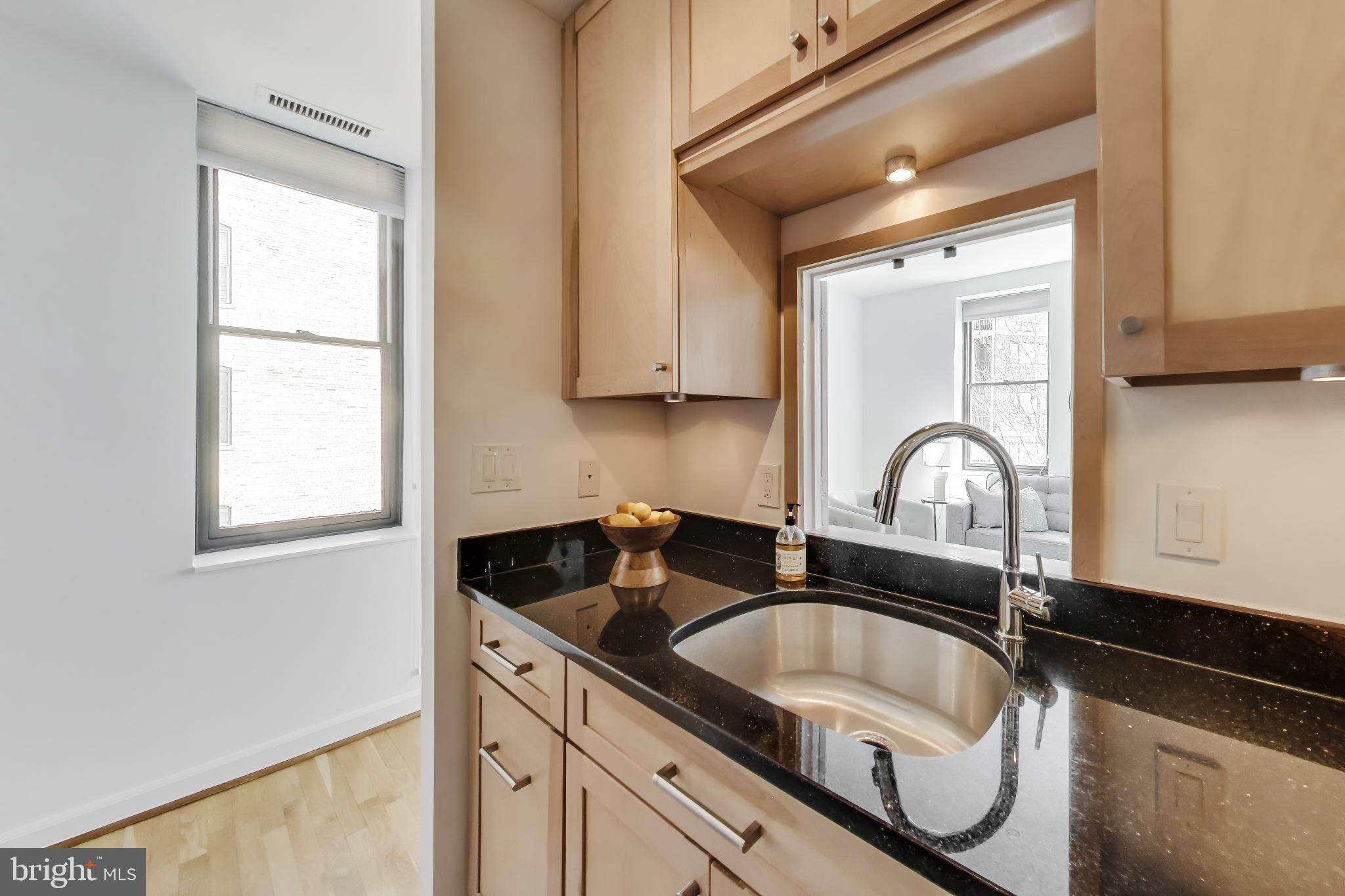1830 17th Street Northwest, Unit 501 Washington, DC 20009 - Photo 9 of 22 Peekaboo window to living room; eastern exposure