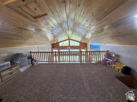 1940 East Shore Road St. Charles, ID 83272 - Photo 28 of 64 Game room with wood ceiling and carpet