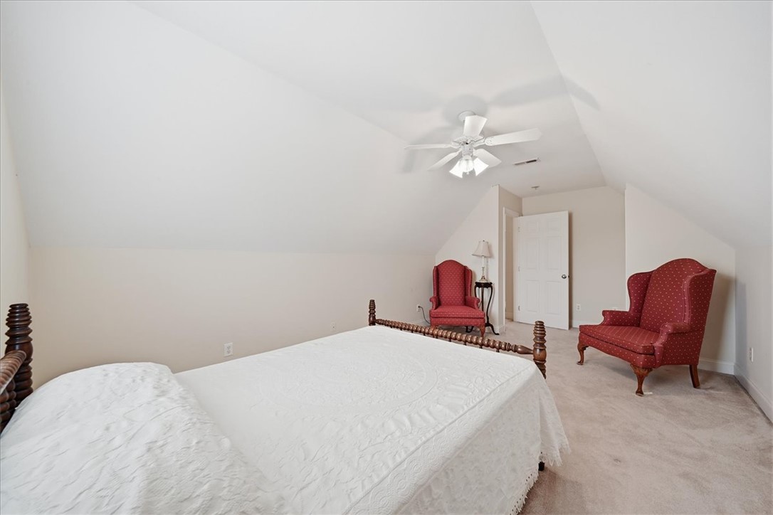 112 Elliott Circle Anderson, SC 29621 - Photo 22 of 35 Sloped ceilings and a ceiling fan complete this cozy, naturally illuminated bedroom.