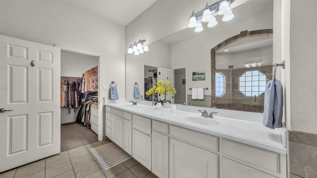 203 Mockingbird Lane Aledo, TX 76008 - Photo 26 of 37 Spacious bathroom featuring a dual vanity with white cabinetry, a large mirror, and tile flooring
