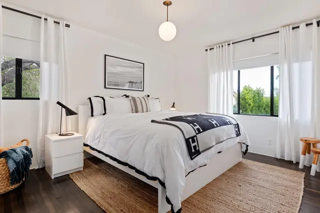 a bedroom with bed and a window